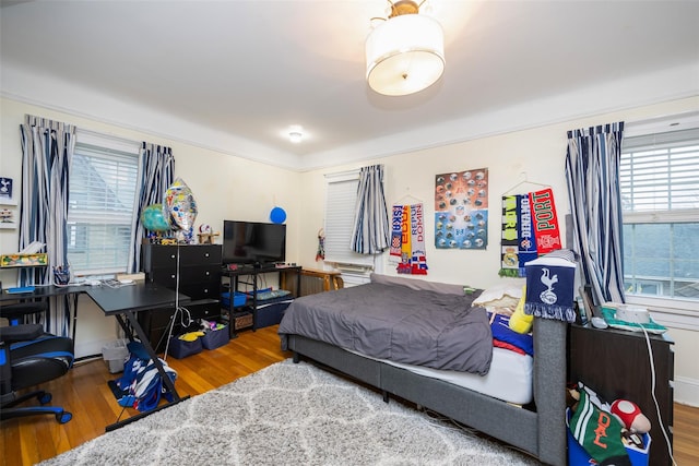 bedroom featuring wood finished floors