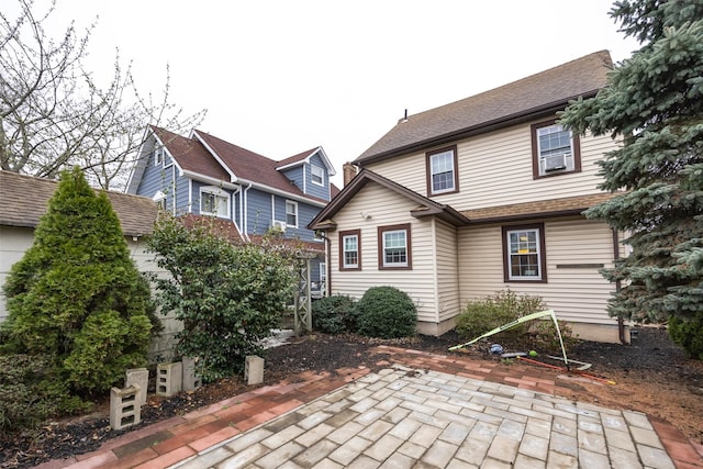 rear view of house featuring a patio