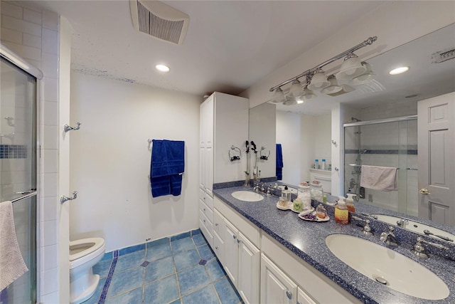 full bathroom featuring a shower stall, tile patterned floors, a sink, toilet, and visible vents