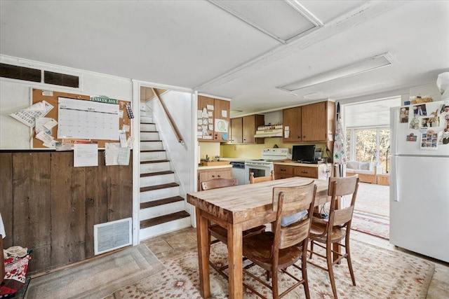 dining room with stairs and visible vents