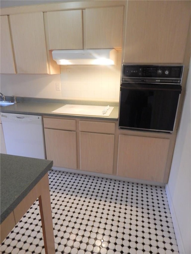 412 Benedict Ave Unit 5J, Tarrytown, NY 10591 - kitchen featuring black oven, extractor fan, light brown cabinets, and dishwasher