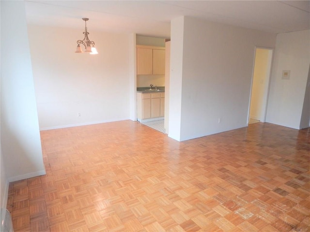 412 Benedict Ave Unit 5J, Tarrytown, NY 10591 - unfurnished room with a chandelier and baseboard heating