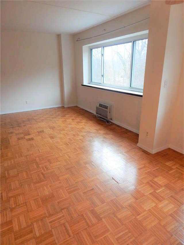 412 Benedict Ave Unit 5J, Tarrytown, NY 10591 - spare room featuring a wall mounted air conditioner and baseboards