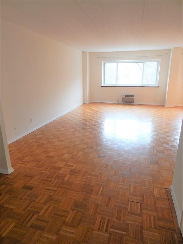 412 Benedict Ave Unit 5J, Tarrytown, NY 10591 - empty room with a wall unit AC and baseboards