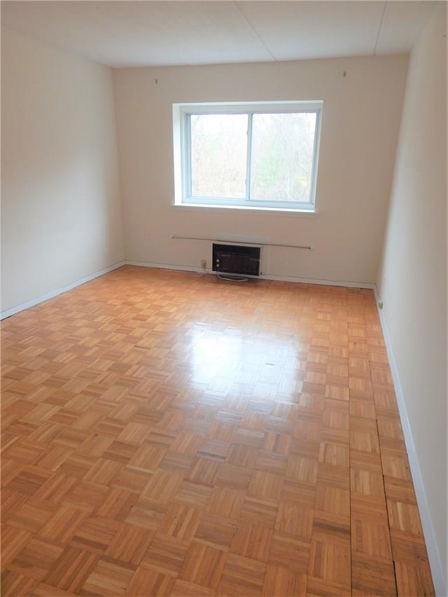 412 Benedict Ave Unit 5J, Tarrytown, NY 10591 - unfurnished room with an AC wall unit and baseboards