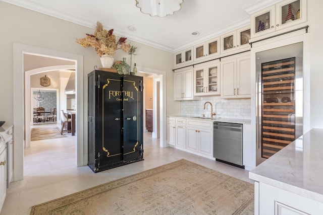 31 Fort Hill Dr, Lloyd Harbor, NY 11743 - kitchen featuring dishwasher, a sink, ornamental molding, backsplash, and beverage cooler