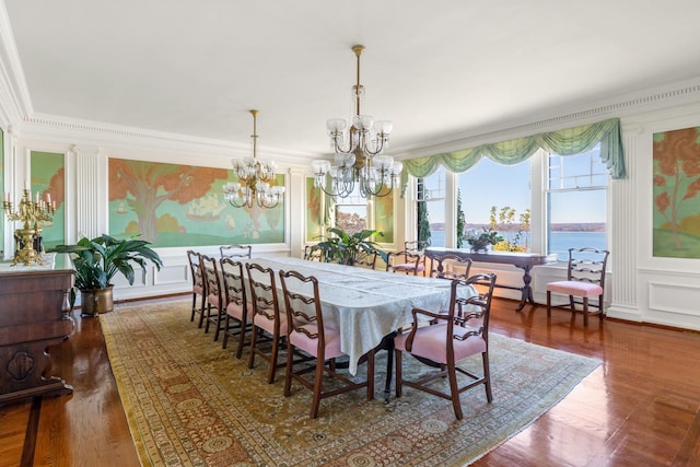 31 Fort Hill Dr, Lloyd Harbor, NY 11743 - dining room with an inviting chandelier, ornamental molding, a wainscoted wall, a decorative wall, and wood finished floors