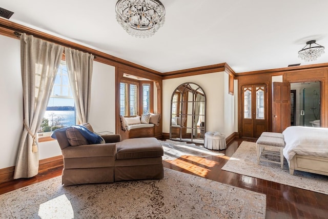 31 Fort Hill Dr, Lloyd Harbor, NY 11743 - living room with a chandelier, baseboards, hardwood / wood-style flooring, and crown molding
