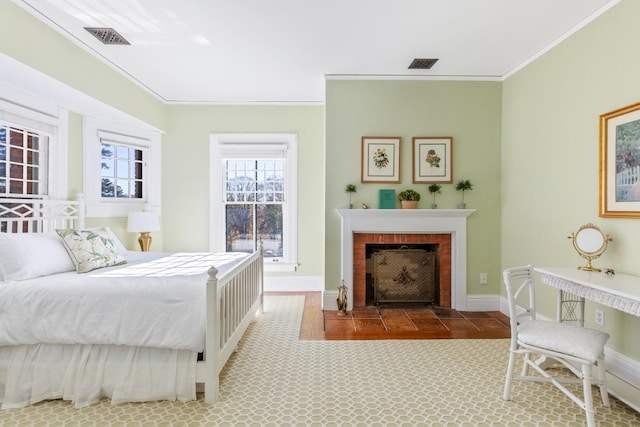 31 Fort Hill Dr, Lloyd Harbor, NY 11743 - bedroom with a fireplace with flush hearth, visible vents, baseboards, and crown molding