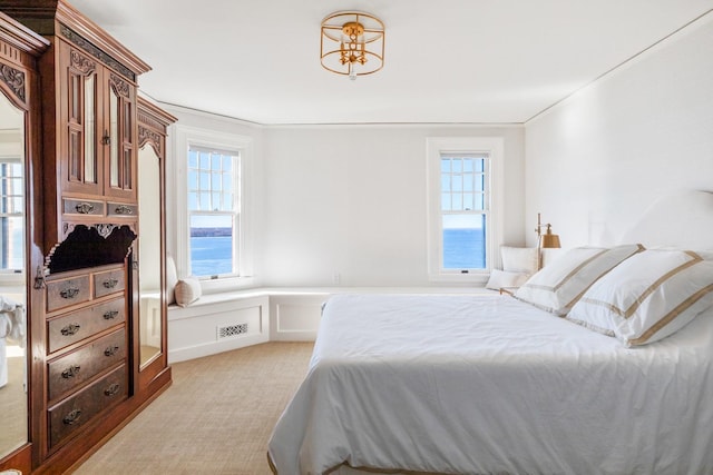 31 Fort Hill Dr, Lloyd Harbor, NY 11743 - bedroom with visible vents, light colored carpet, and ornamental molding