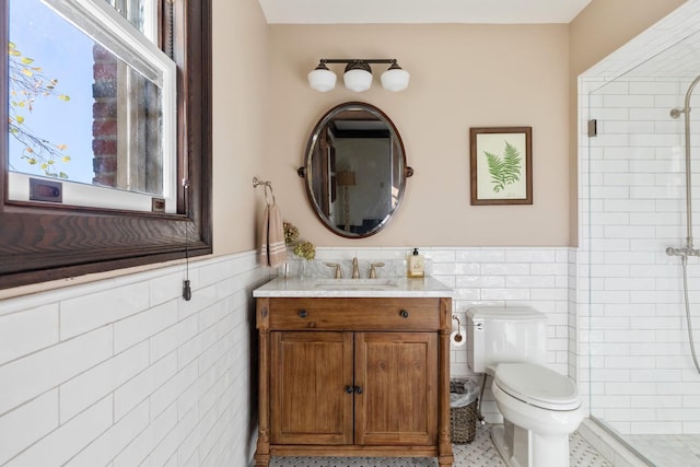 31 Fort Hill Dr, Lloyd Harbor, NY 11743 - full bath with a tile shower, vanity, a wainscoted wall, toilet, and tile walls