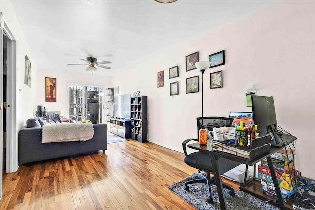 3145 37th St, Astoria, NY 11103 - office with baseboards, hardwood / wood-style flooring, and a ceiling fan