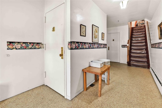 3145 37th St, Astoria, NY 11103 - corridor featuring stairway, a baseboard radiator, and speckled floor