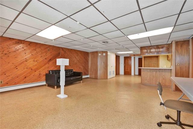 3145 37th St, Astoria, NY 11103 - interior space with visible vents, a dry bar, a baseboard radiator, wooden walls, and a drop ceiling