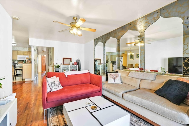 3145 37th St, Astoria, NY 11103 - living area with light wood-style floors and a ceiling fan