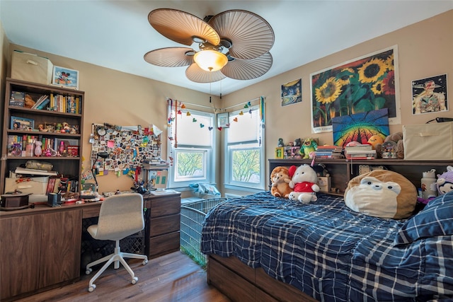 bedroom with a ceiling fan and wood finished floors