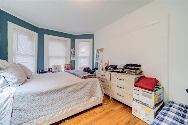 61 Haseco Ave, Port Chester, NY 10573 - bedroom featuring light wood-style flooring and ornamental molding