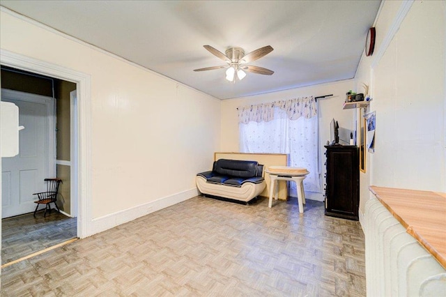 61 Haseco Ave, Port Chester, NY 10573 - living area with a ceiling fan and baseboards
