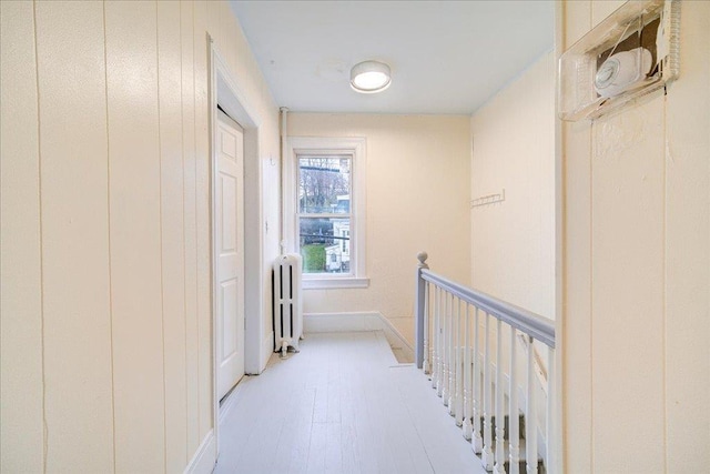 61 Haseco Ave, Port Chester, NY 10573 - hallway with radiator and light wood-style floors