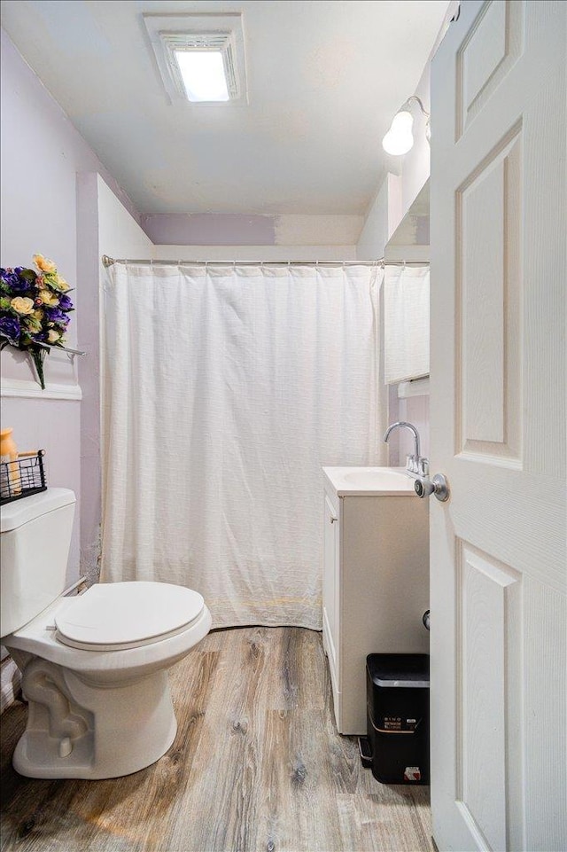 61 Haseco Ave, Port Chester, NY 10573 - full bath featuring wood finished floors, vanity, and curtained shower