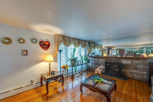 living area with hardwood / wood-style floors