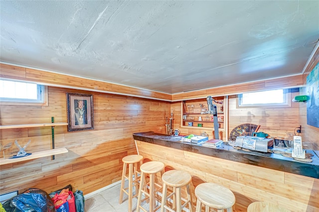 bar with wood walls and a bar