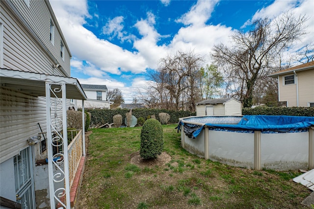 view of yard with a fenced in pool
