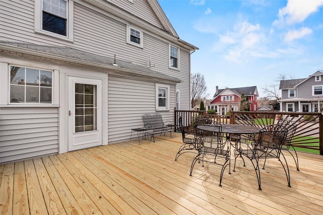 wooden deck featuring outdoor dining space