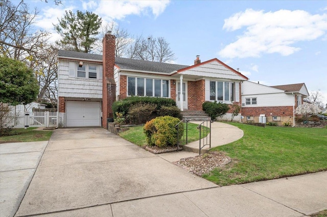 18 Hilary Ln, Westbury, NY 11590 - view of front of property with a front yard, brick siding, a gate, and driveway