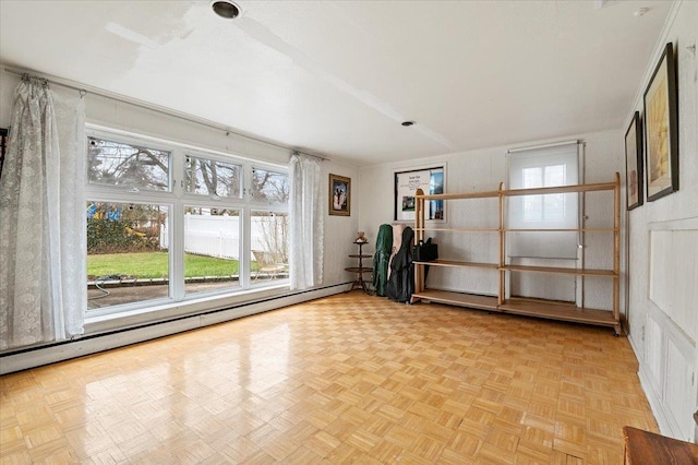18 Hilary Ln, Westbury, NY 11590 - unfurnished room with a baseboard heating unit and a healthy amount of sunlight