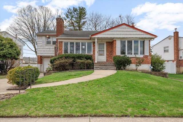 18 Hilary Ln, Westbury, NY 11590 - view of front of property with a front yard, brick siding, a garage, and a chimney