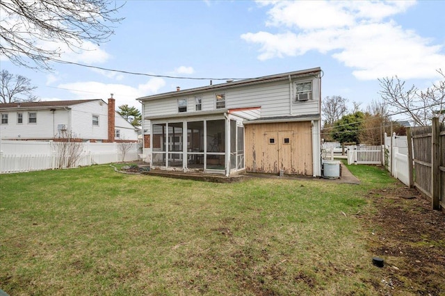18 Hilary Ln, Westbury, NY 11590 - rear view of property featuring a yard, a fenced backyard, and a sunroom