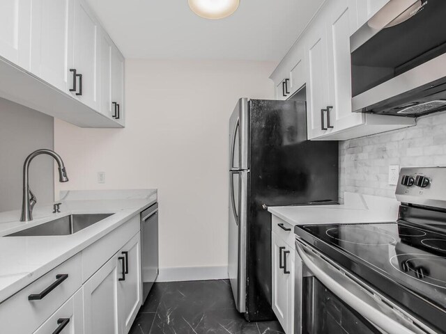 25 Rockledge Ave Unit 117, White Plains, NY 10601 - kitchen with a sink, backsplash, white cabinets, and appliances with stainless steel finishes