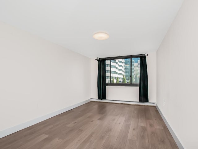 25 Rockledge Ave Unit 117, White Plains, NY 10601 - empty room with baseboards and wood finished floors