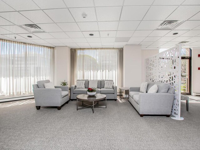 25 Rockledge Ave Unit 117, White Plains, NY 10601 - living room featuring a baseboard heating unit, visible vents, and carpet floors
