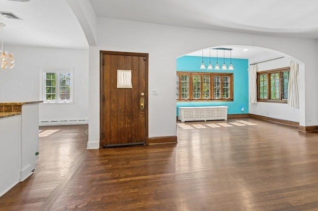 51 Valley Rd, Larchmont, NY 10538 - foyer entrance featuring radiator, a baseboard radiator, healthy amount of natural light, and wood finished floors