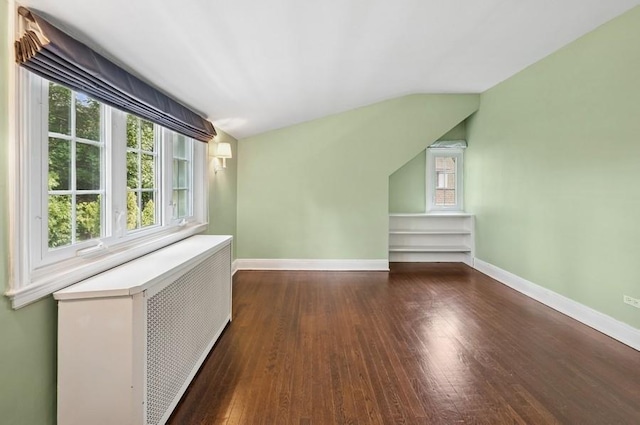51 Valley Rd, Larchmont, NY 10538 - additional living space featuring radiator heating unit, dark wood-style floors, and lofted ceiling