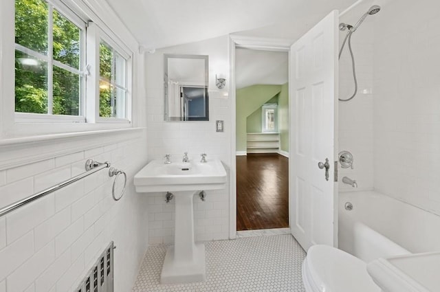 51 Valley Rd, Larchmont, NY 10538 - bathroom with lofted ceiling,  shower combination, and tile walls