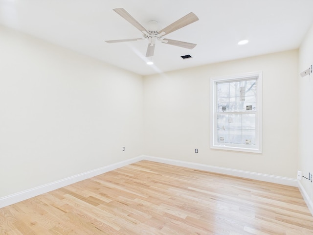 unfurnished room with recessed lighting, light wood-type flooring, baseboards, visible vents, and a ceiling fan