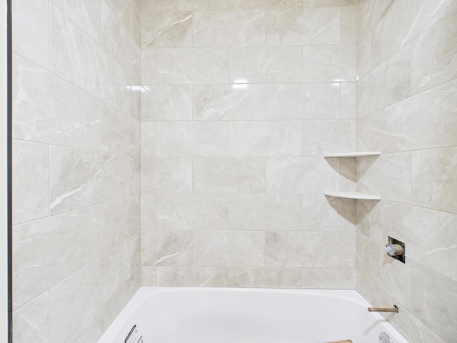 bathroom with shower / washtub combination
