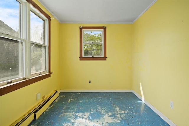 unfurnished room with a baseboard heating unit, baseboards, and ornamental molding