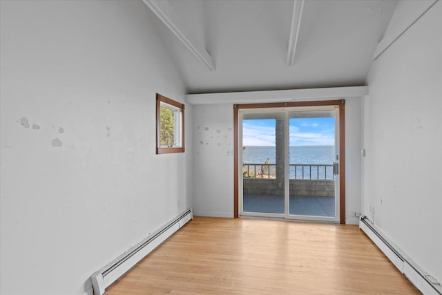 unfurnished room featuring a baseboard radiator, a water view, light wood-style floors, healthy amount of natural light, and vaulted ceiling