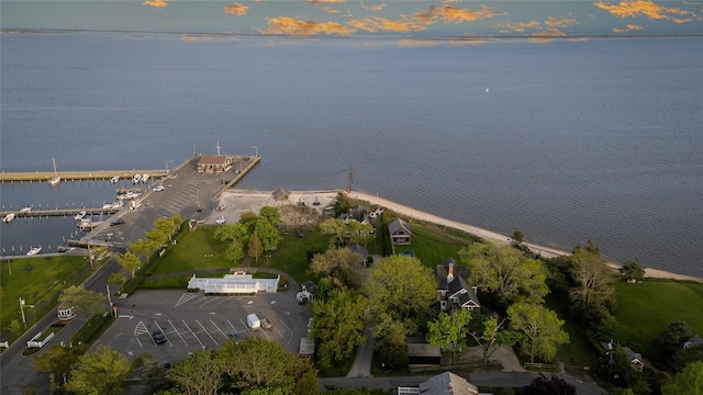 aerial view of property and surrounding area featuring a nearby body of water