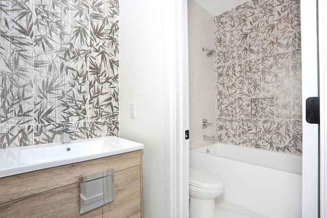 bathroom featuring vanity, toilet, and tub / shower combination