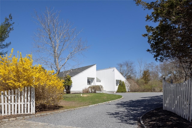 3 Clay Pit Rd, Remsenburg, NY 11960 - view of side of property featuring a yard and fence