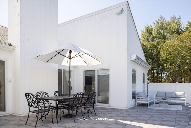 3 Clay Pit Rd, Remsenburg, NY 11960 - rear view of property with outdoor dining area, a patio, fence, and an outdoor living space
