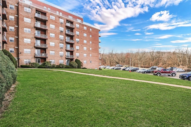 view of property featuring uncovered parking