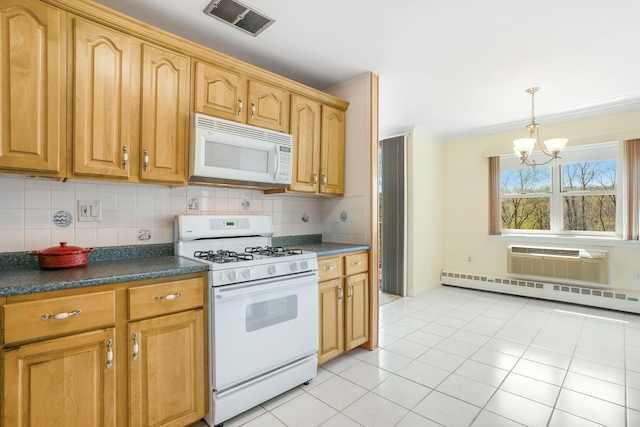 kitchen with light tile patterned flooring, a notable chandelier, visible vents, white appliances, and dark countertops