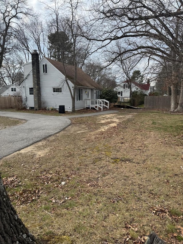 250 Wheeler Rd, Hauppauge, NY 11788 - view of yard featuring driveway and fence
