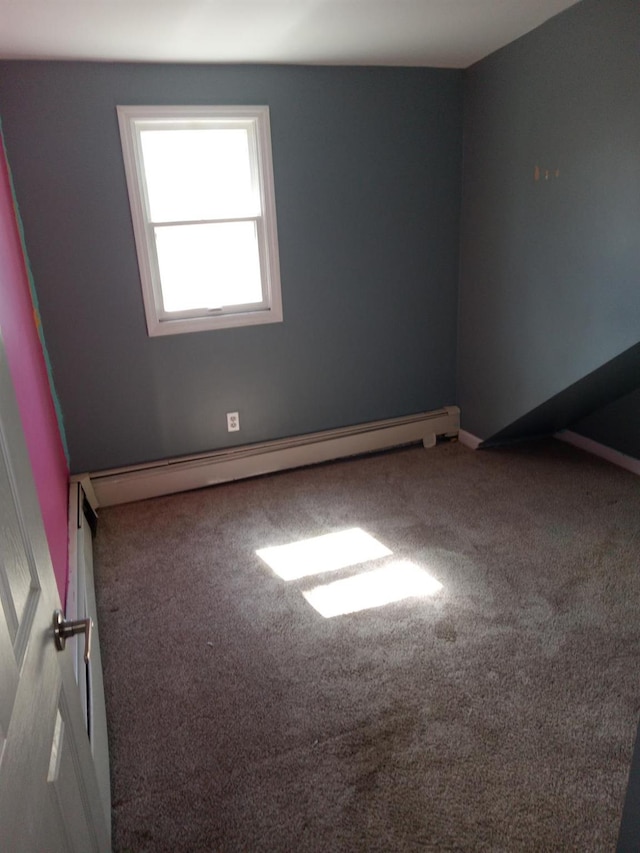 250 Wheeler Rd, Hauppauge, NY 11788 - spare room with a baseboard heating unit and carpet floors
